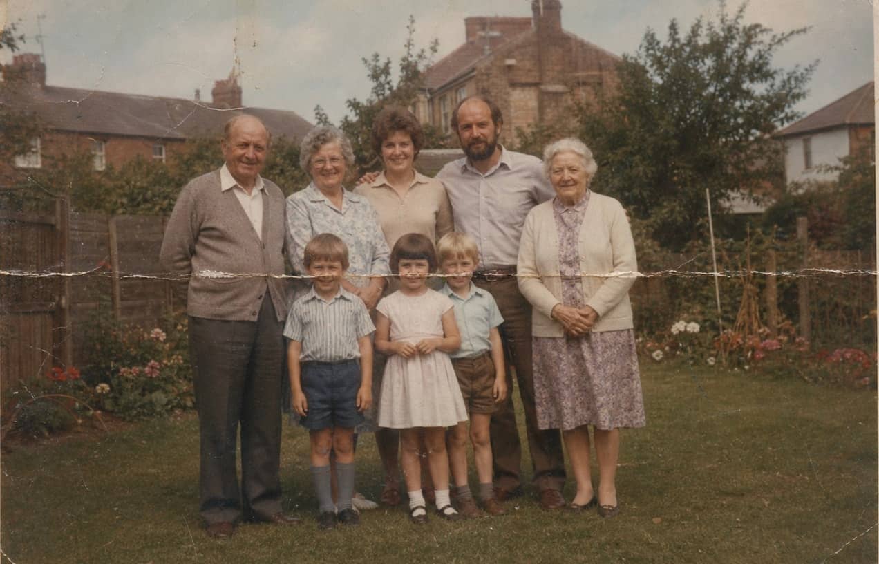 Faded family portrait before restoration